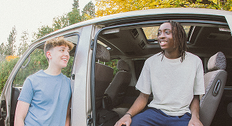 Two friends talking in a car.