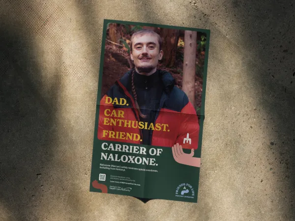Image of poster with a male with a mustache and a black shirt