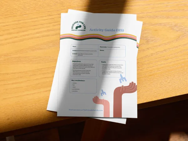 Activity sheets with Friends for Life logo and two hands holding Naloxone