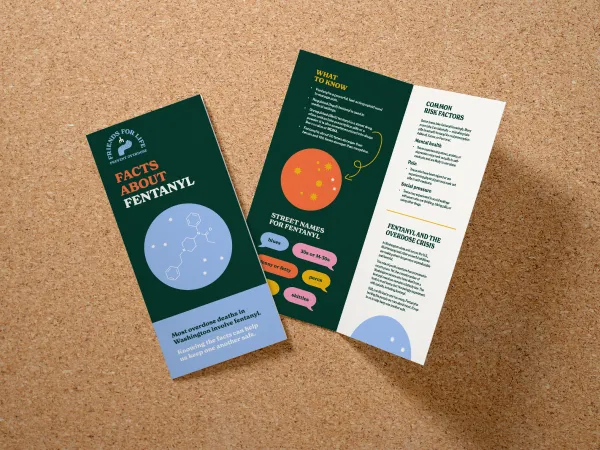 Bifold brochure with a dark background and blue and orange circles