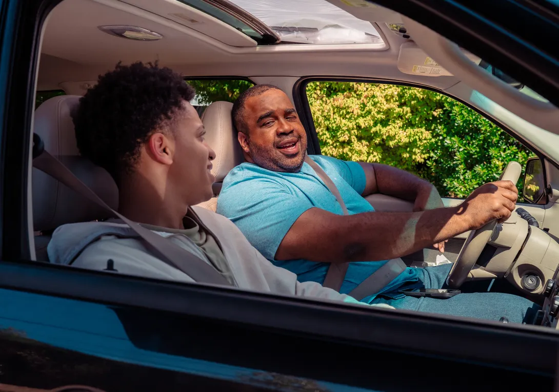 Guardian talks to teen in car.